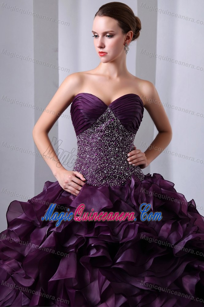 Dark Purple Sweetheart Beaded Dress for a Quinceanera Ruffled Layers