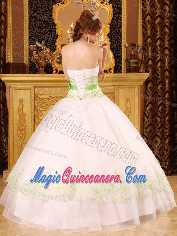 White Strapless Sweet 15 Dress with Green Embroidery and a Bowknot Sash